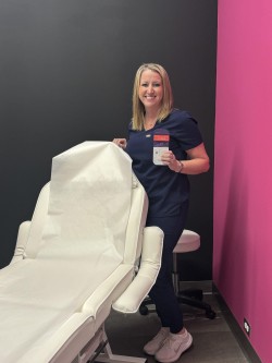 Emily Rozsonits inside ER Wellness spa welcoming patients